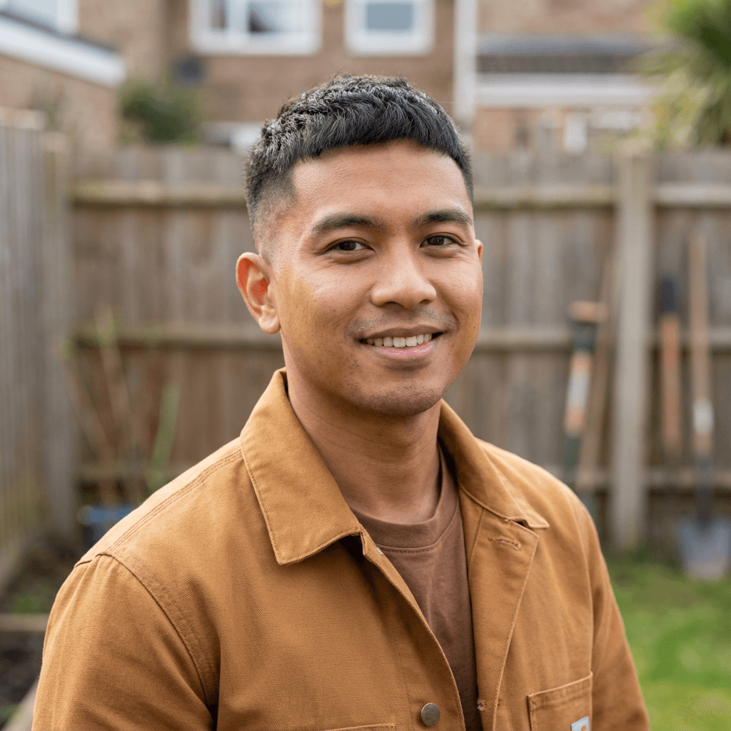 Andrew Kim in a work shirt on a job site
